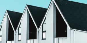 dark grey composite shingle roof on modern duplex